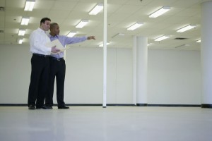 Two men in an empty office space