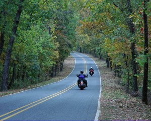 Two men on bikes on a lonely road