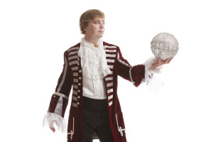 A man in a costume holding a disc.