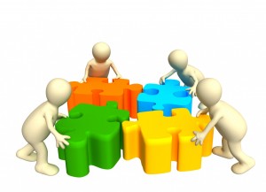 A graphic image of four people working together as a team