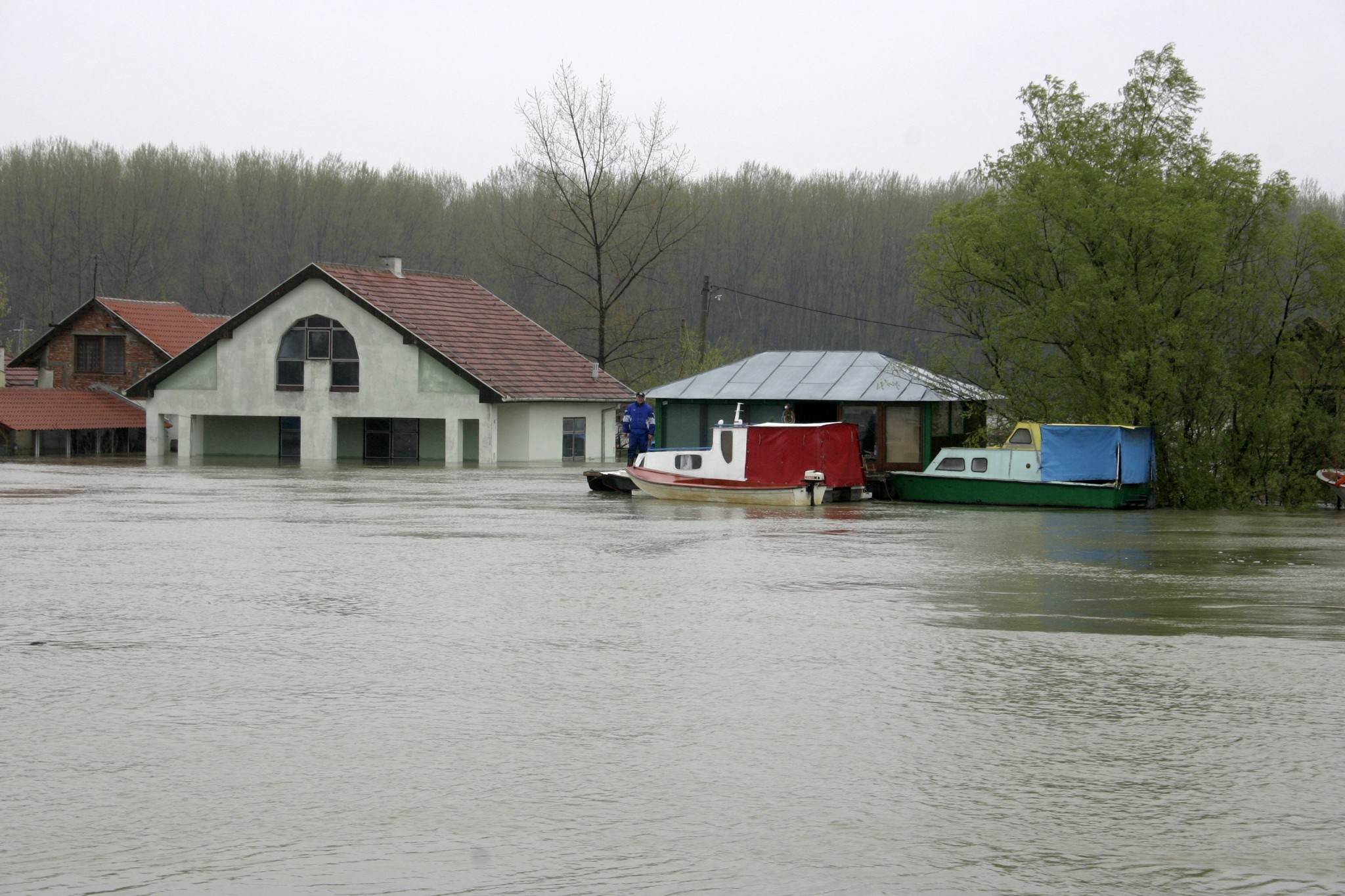 A flooded area in front of a house.