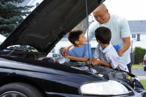 A man is working on a car.