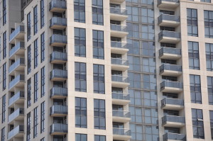 A close up of an apartment building with balconies.