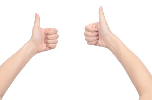 Two hands giving thumbs up on a white background.