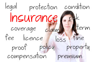 A woman writing the word insurance on a white background.