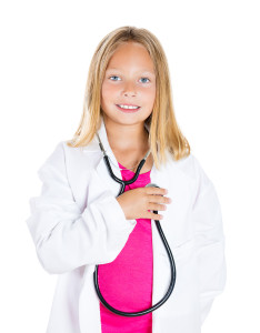 A little girl holding a stethoscope.