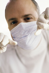 A man wearing a mask and gloves.