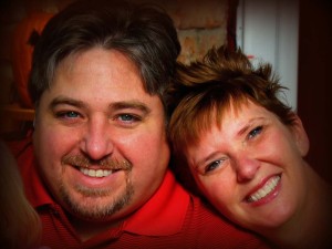 A man and woman smiling for the camera.