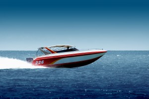 A red and white boat in the water.