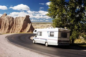 A rv is parked on a road.