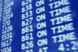 A close up of a flight information screen.