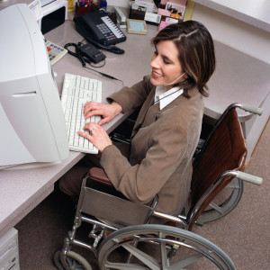 A woman in a wheelchair.