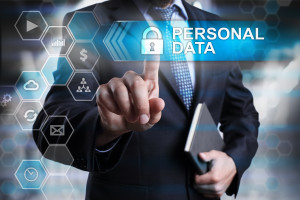 A businessman is pointing at a button that says personal data.