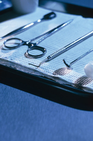 A tray of surgical tools on a table.