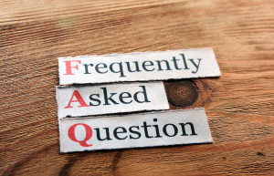 A poster of “Frequently Asked Questions” on a table