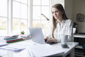 A woman working on a laptop