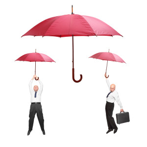 Two men hanging from their umbrellas