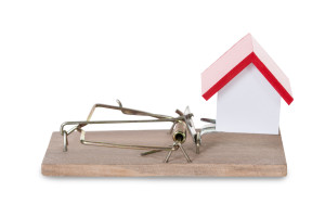 A mousetrap with a house on top of it.