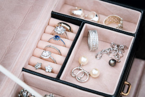 A jewelry box filled with rings, necklaces, and pearls.