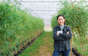 A smiling woman on a farm