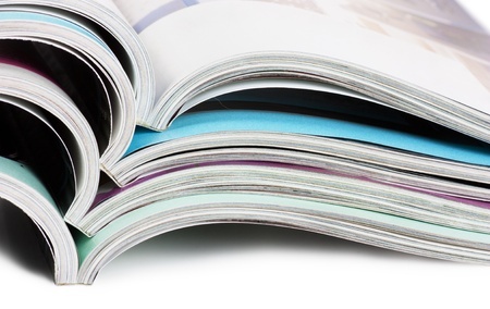 An open magazine on a white background.