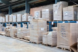 A warehouse full of boxes and pallets.