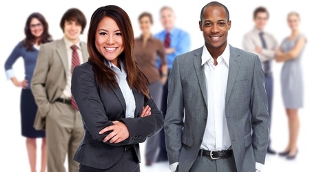 A group of business people standing in front of a white background.