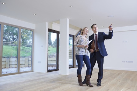 A couple looking at a new house.