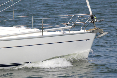 A white sailboat in the water.