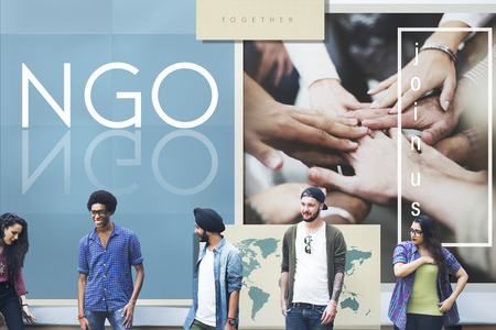 A group of people standing in front of a poster with the word ngo.